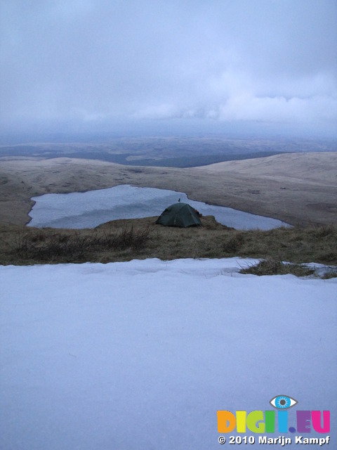 SX12933 Camping next to snow above Llyn y Fan Fawr lake